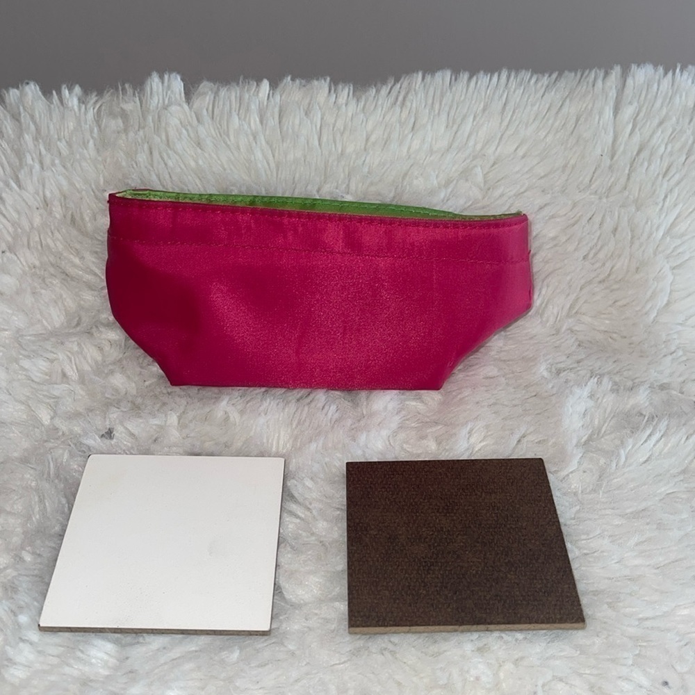 Pencil bag and 2 sample painting boards with Velcro stickers on the back .